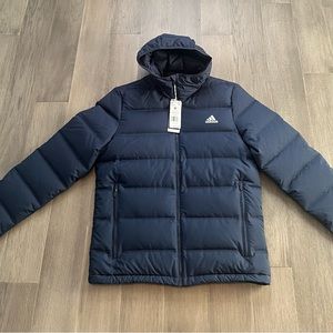 New with tags mens Adidas helionic down jacket. Legend ink color. Size medium.